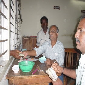 Chennai (Tamil Nadu) Officers handing out the money to residents whose livelihood wasdestroyed
